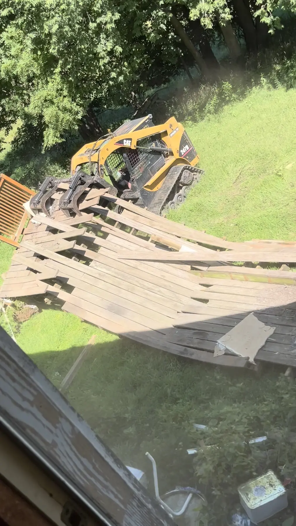 Old deck being removed from a house